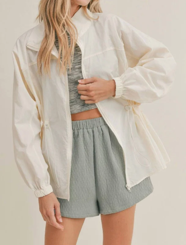 Zippered Nylon Jacket In Ivory Toggled Jacket Drawstring Jacket Belted Jacket